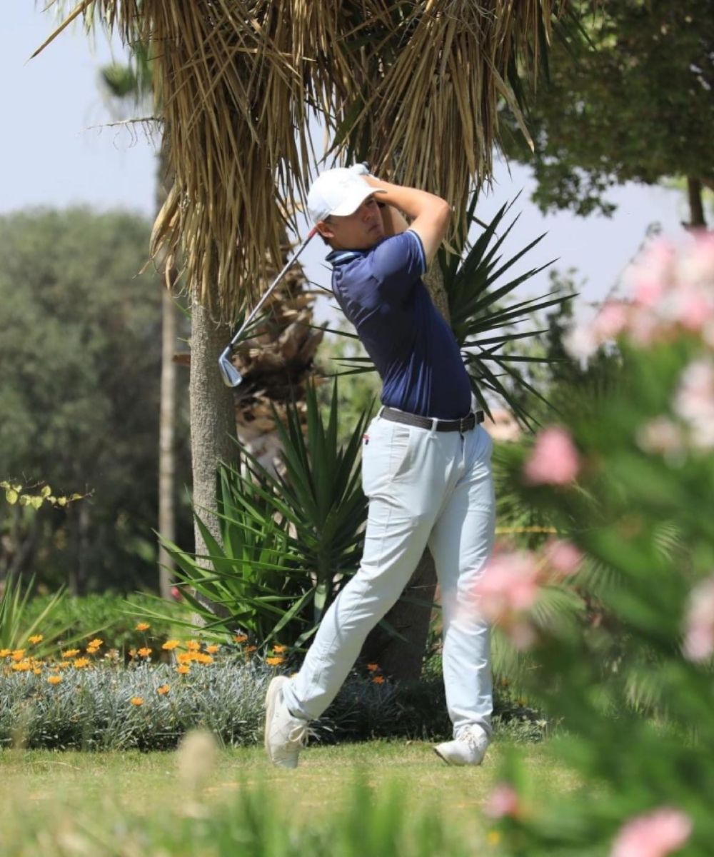 Kristof Ulenaers hitting a golf shot during a tournament