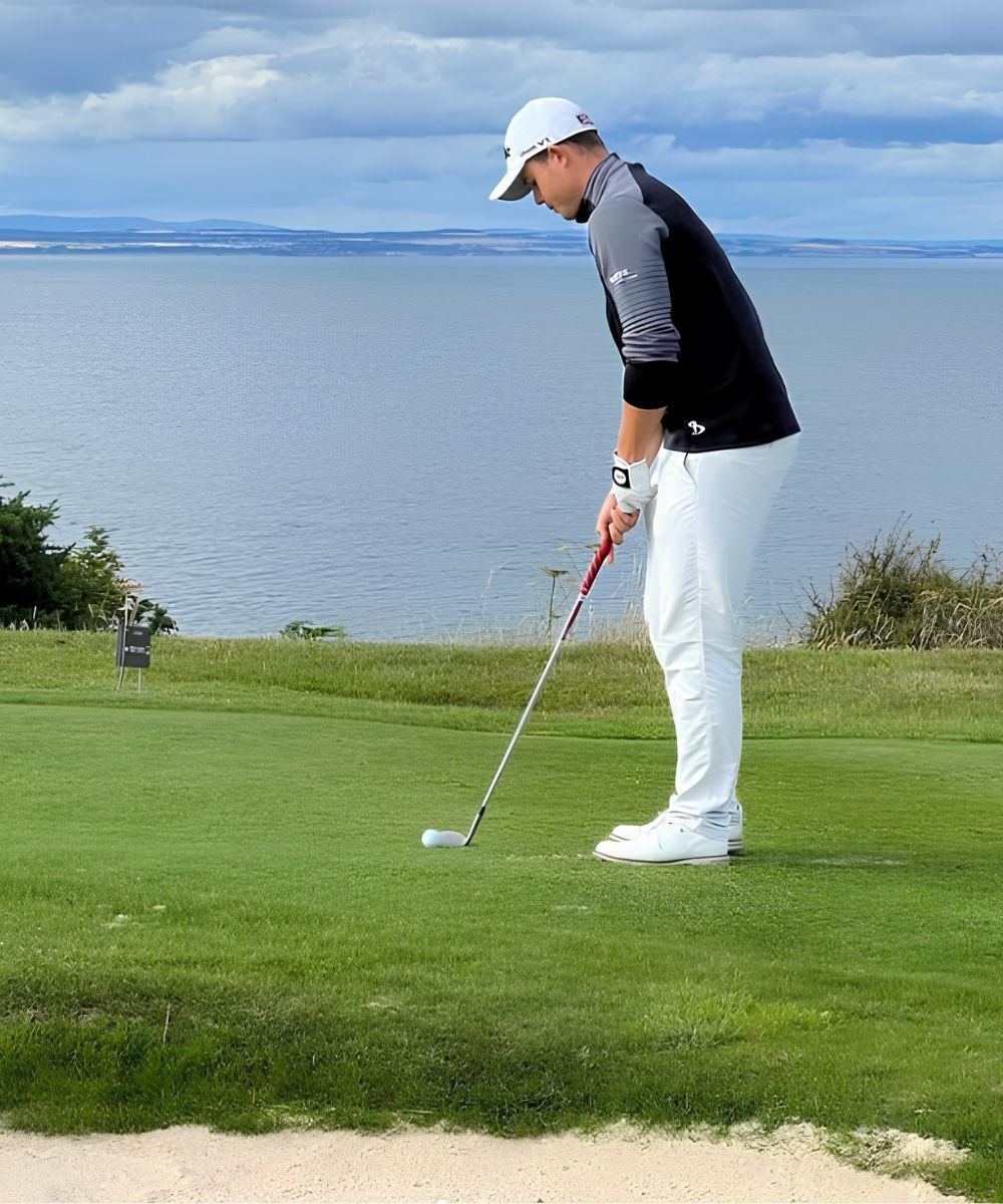 Kristof Ulenaers as a Belgian professional golfer preparing a shot on the course